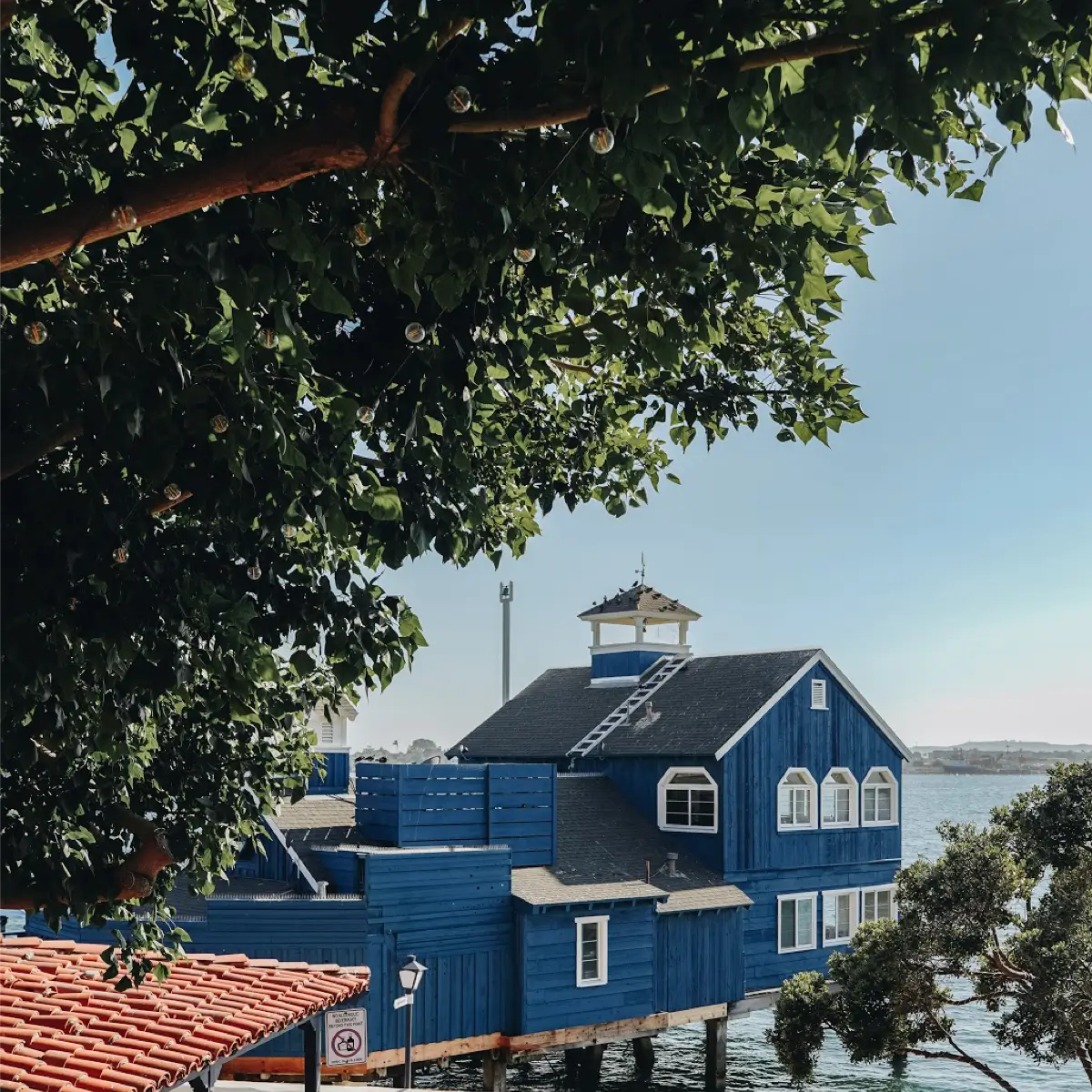 View of a blue building over the water at Seaport Village. 