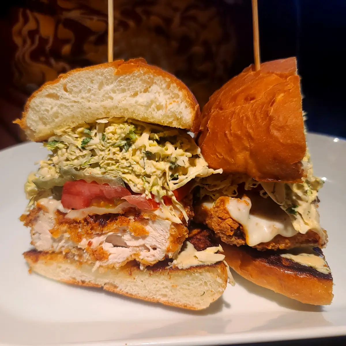 A fried chicken burger with cabbage and tomato from Common Stock.