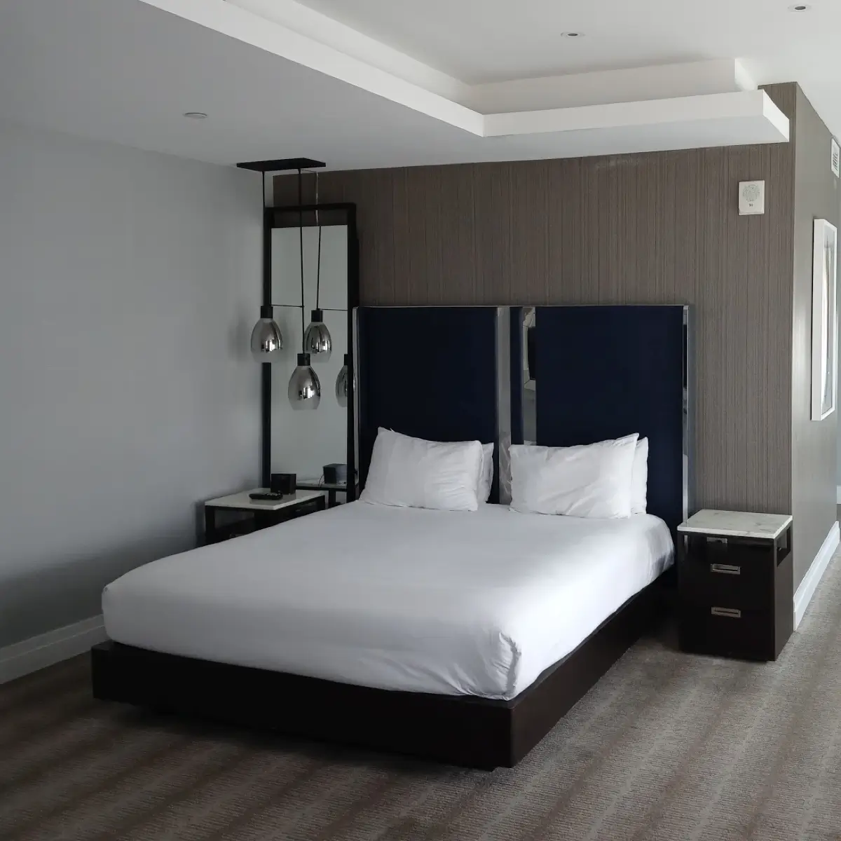 A hotel room with king sized bed at The Kimpton hotel.