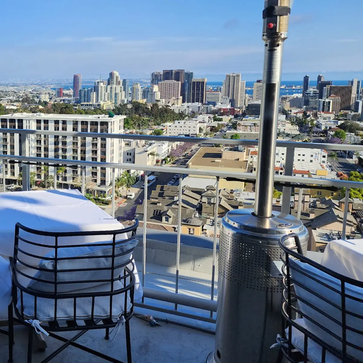 A rooftop view table facing Downtown San Diego at Mister A's.