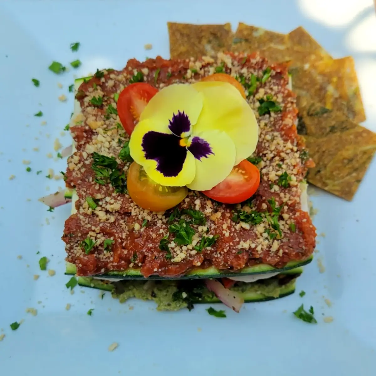 A raw dish with decorative flower from Peace Pies. 
