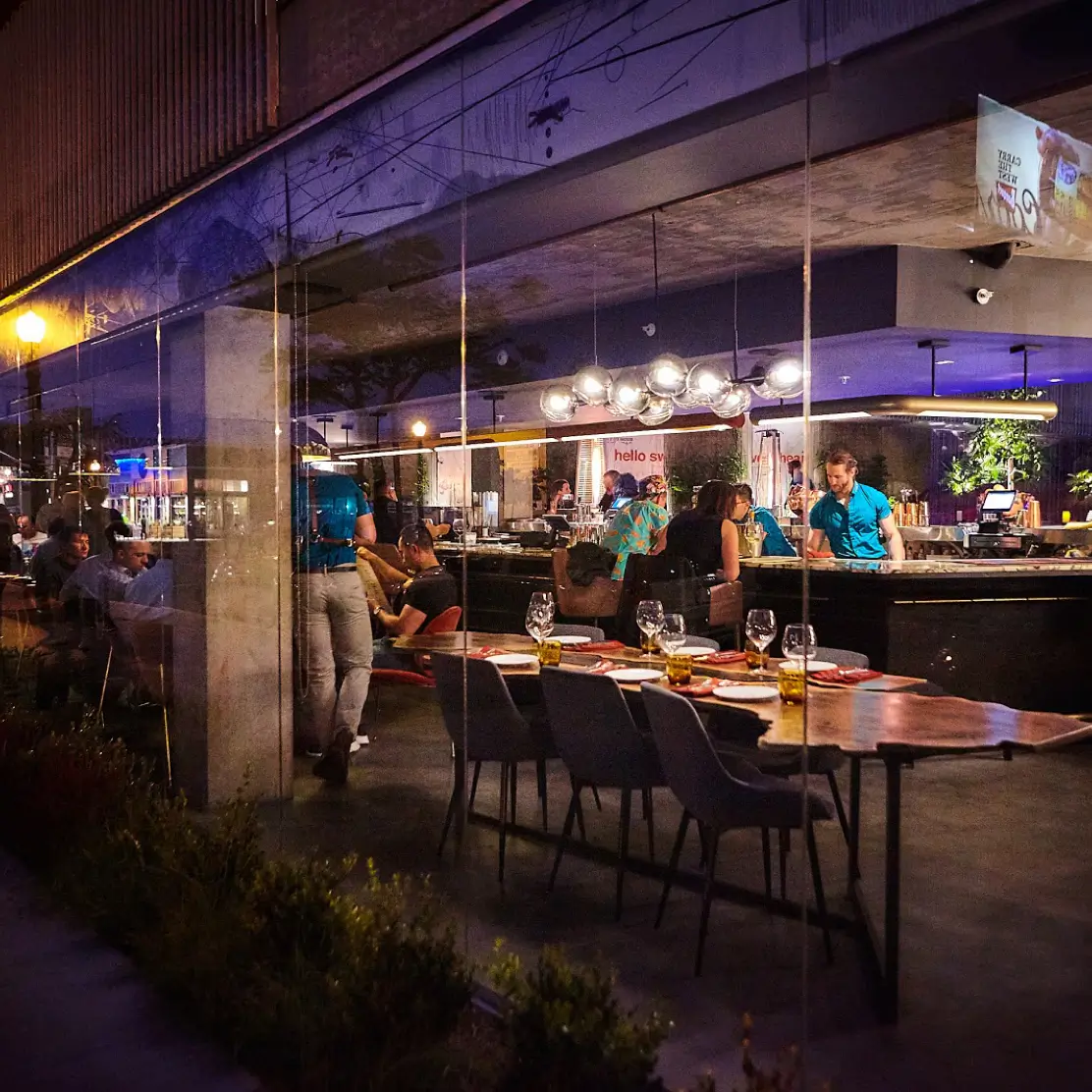 Dining table and bar at insideOUT LGBTQ+ bar